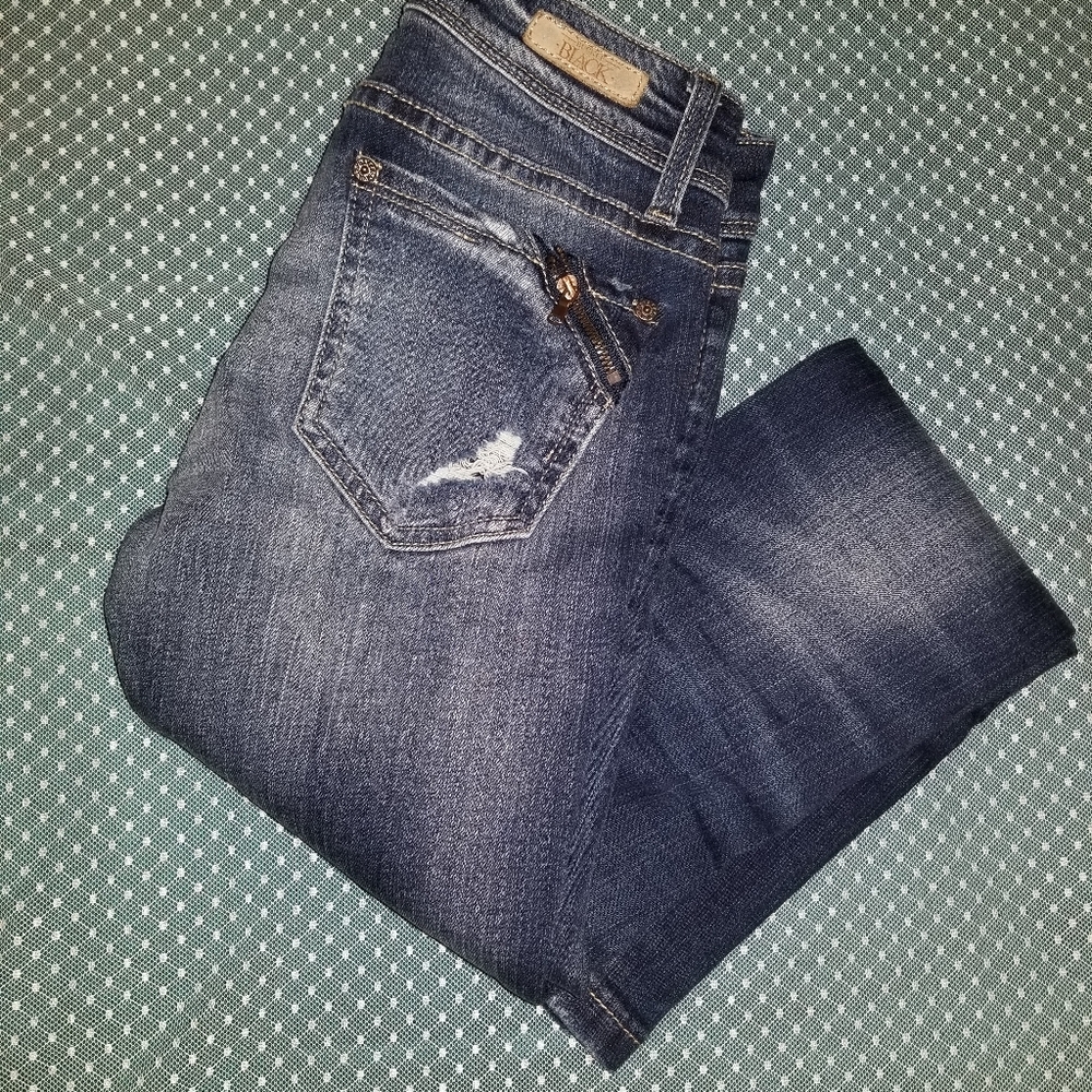 Buckle black skinny jeans